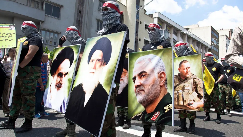 In a scene from happier day for the Islamic Regime, a Quds Day rally features a parade of military forces, along with a photograph of Qasem Soleimani, assassinated the following January; Iran Tehran, ...