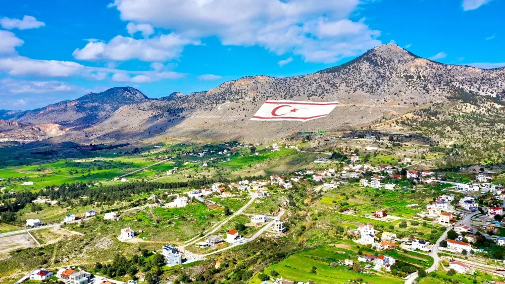 The Turkish flag is displayed on a hill in the Nicosia region of Northern Cyprus.  Shutterstock