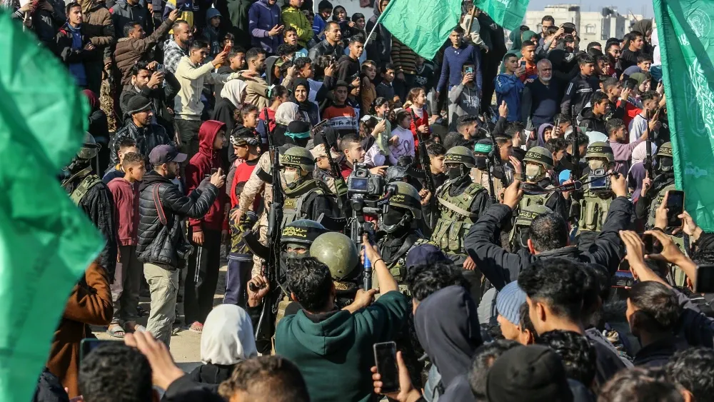 Hamas terrorists at the handover of Israeli hostages to the Red Cross. Khan Yunis, Gaza, Jan. 30, 2025.  Shutterstock