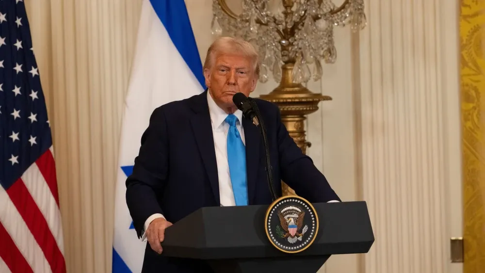 President Donald Trump in the White House East Room. Shutterstock