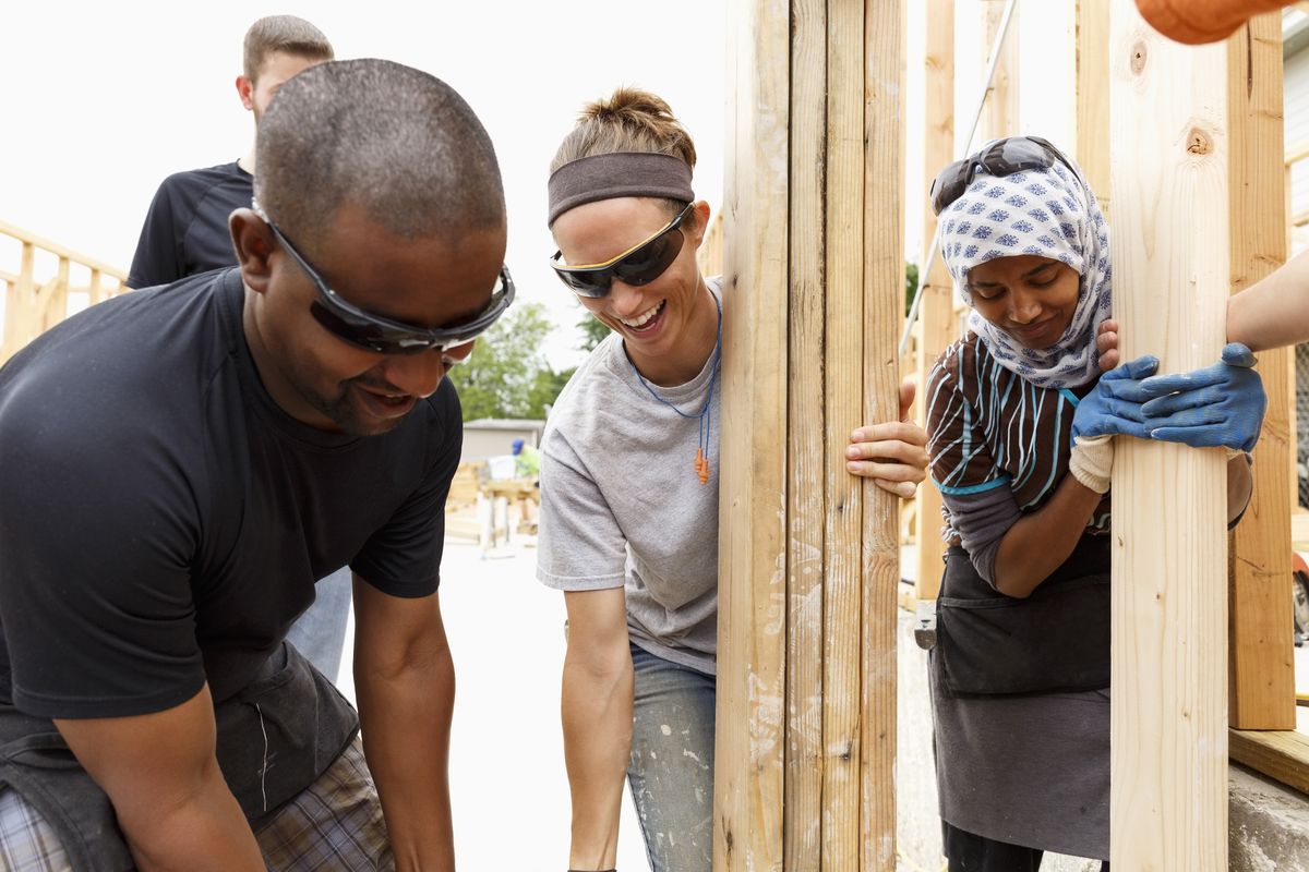 3 people working together to build property