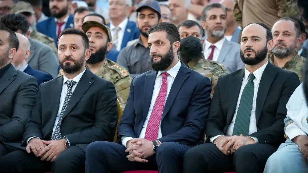 Syria’s interim President Ahmad al-Sharaa (center) at a May 27, 2025, celebration of the lifting of sanctions. Shutterstock