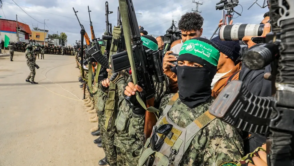 Hamas has slow-rolled the release of the 28 slain hostages. By Sunday, it had handed over only 12, six days after the end of the 72-hour window to give up all 28 bodies. Above: Hamas's Al-Qassam Briga...