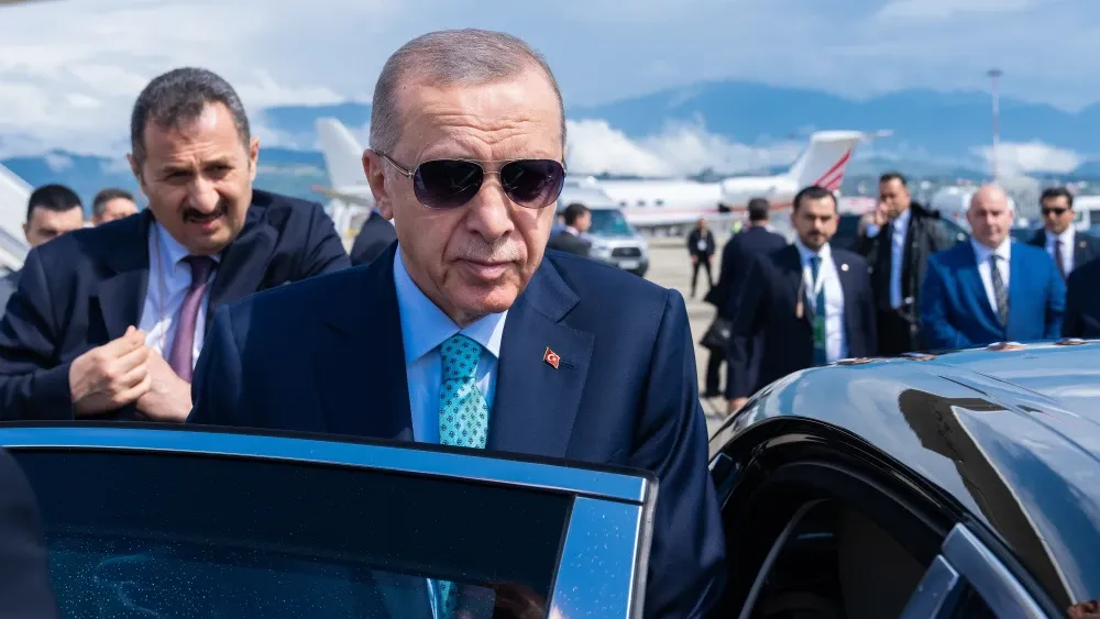 Turkish President Recep Tayyip Erdoğan and his security officials during a visit to Sochi, Russia.  Shutterstock