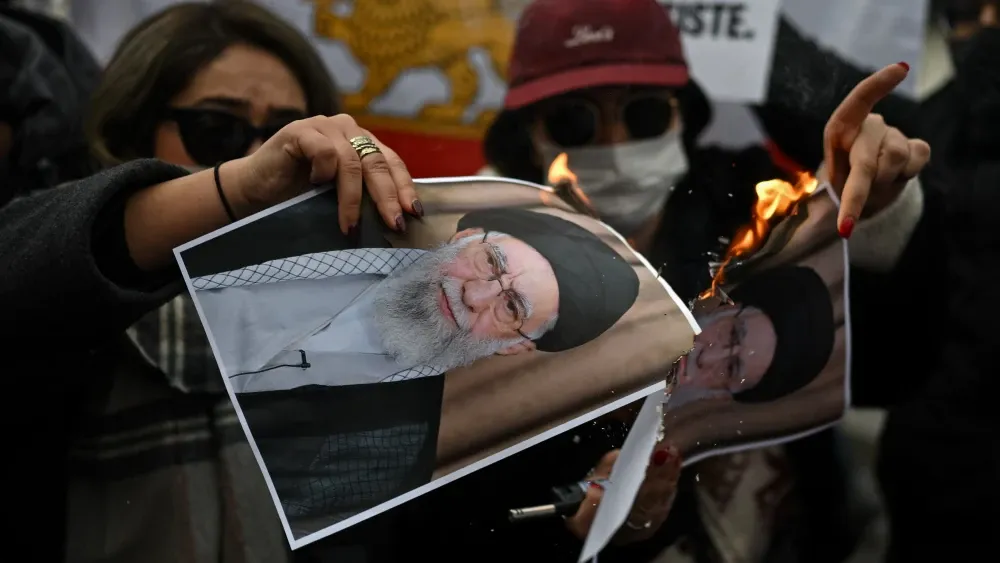 Protesters burn pictures of Supreme Leader Ali Khamenei in Milan, Italy, in sympathy with Iranian protesters, January 17, 2026.  Shutterstock