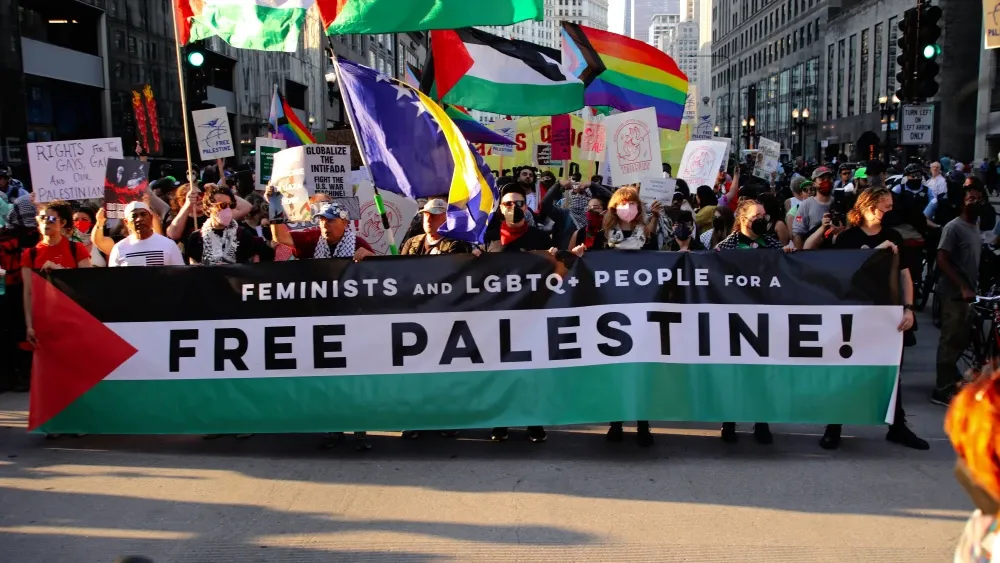 Pro-Palestinian, pro-choice and LGBTQ+ rights activists march in Chicago before the start of the 2024 Democratic National Convention. Shutterstock