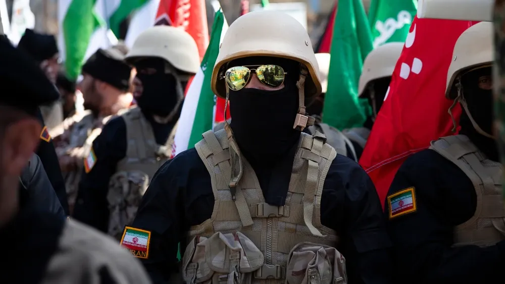 Iranian military members march on Quds Day in Tehran in 2024. Shutterstock