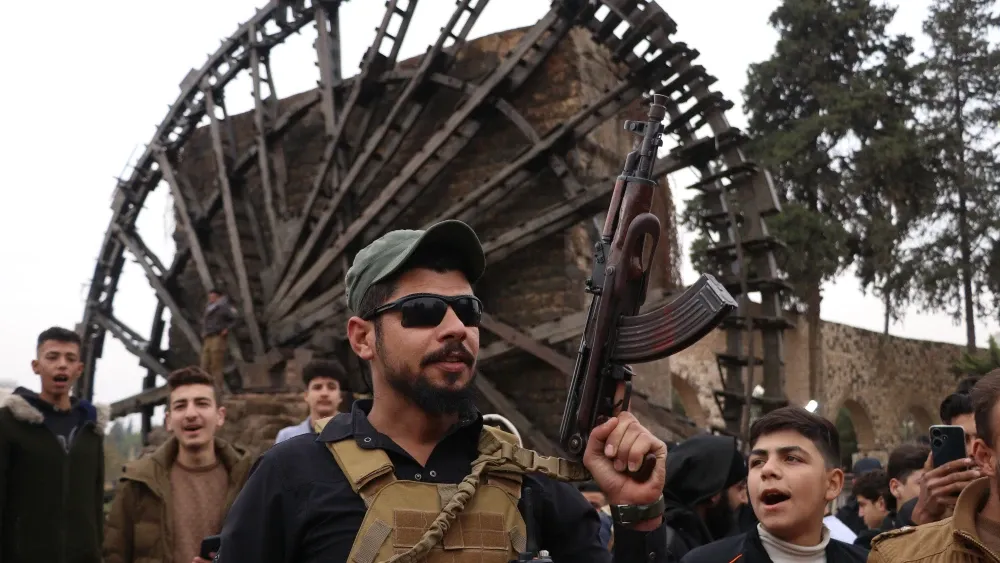 Fighters with Ha’yat Tahrir al-Sham are shown in Syria after Bashar al-Assad’s downfall in December 2024. Shutterstock