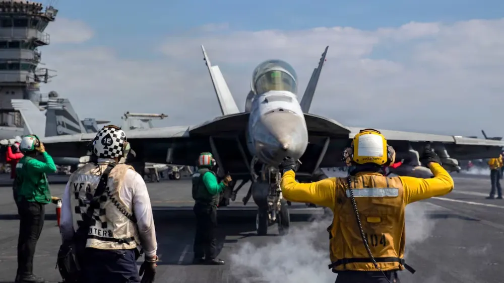 An F/A-18F Super Hornet, attached to Strike Fighter Squadron (VFA) 41, prepares to launch from the flight deck of Nimitz-class aircraft carrier USS Abraham Lincoln (CVN 72) in support of Operation Epi...