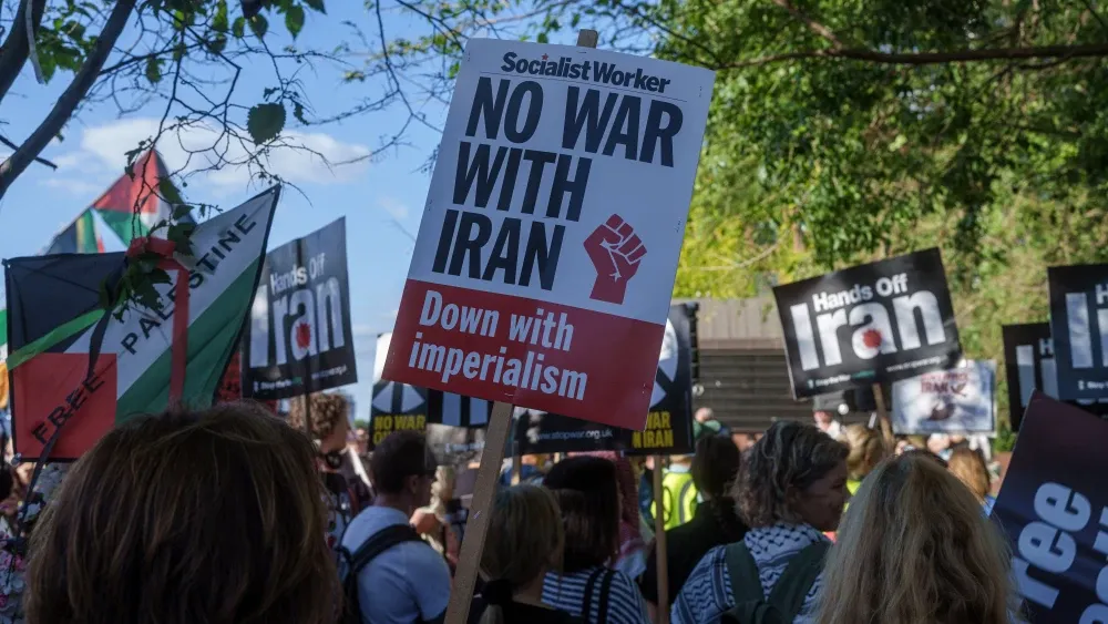 Activists gather with Palestinian flags and 