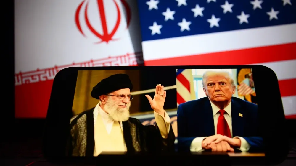 Iran's Supreme Leader Ali Khamenei and U.S. President Donald Trump are shown on a smartphone screen.  Shutterstock