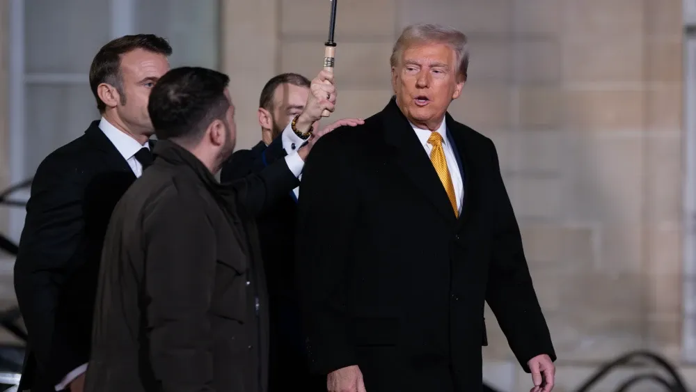 President Donald Trump met with Ukrainian President Volodymyr Zelensky (second from left) in December in Paris, before taking office. Shutterstock